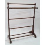 Stained wood ring- turned five-bar towel rail