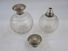 A 1940s glass and silver lidded scent bottle, circular glass bottle with silver circular engine