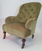 Late Victorian salon chair in olive green button backed upholstery, turned front legs to black china