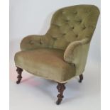 Late Victorian salon chair in olive green button backed upholstery, turned front legs to black china