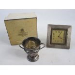 A 1920s silver mounted square framed alarm clock, Arabic numerals to the dial, engine turned