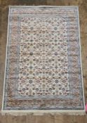 Kashmir foliate pattern ivory ground carpet on stepped border, 172cm x 118cm