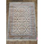 Kashmir foliate pattern ivory ground carpet on stepped border, 172cm x 118cm