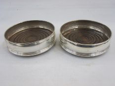 Pair of late 20th century silver-mounted and turned wood wine coasters, slightly bulbous, London,