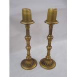 Pair gilt antique-finish tall pillar candlesticks each with fluted and foliate knopped stem, petal
