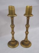 Pair gilt antique-finish tall pillar candlesticks each with fluted and foliate knopped stem, petal