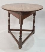 18th century oak cricket table with circular top, on turned baluster supports with plain stretchers,