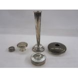 White metal powder box of circular form, unmarked, a silver candlestick and various other items