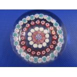 Baccarat paperweight, millefiori decorated with five rings of coloured canes, 6.5cm diameter, with