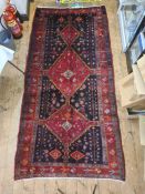 Persian Hamadan village rug, the blue ground with three red ground medallions, the field with