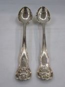 Pair of William IV silver hour-glass pattern serving spoons by William Eaton, London 1830, with