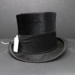 An early 20th century top hat by Carel Netto, Dordrecht, Holland, size 54, 3 1/2, H.14.5cm