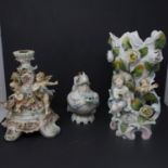 Three Meissen style porcelain pieces, to include a figural candlestick with cherubs and encrusted
