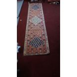 A North West Persian Senneh Kilim, the repeated diamond medallion with repeating petal motifs, on