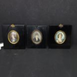 Three 19th century portrait miniatures, depicting two ladies and a gentleman, in matching ebonised