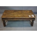 A vintage Sheesham wood coffee table, with iron corner fittings and struts, H.40 W.109 D.60cm