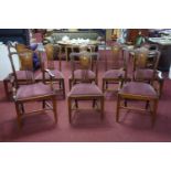 A set of 8 Edwardian inlaid mahogany dining chairs to include 2 carvers
