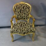 A French style gilt wood fautelli in leopard print upholstery