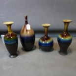 Four Persian drip glazed vases of varying size and form, H.35cm (tallest)