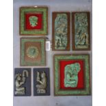 A collection of 7 Mexican Aztec wall plaques