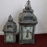 Two storm lanterns, tallest H.79cm