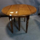 A 19th century fruitwood extending dining table with 3 extra leaves