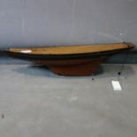 A vintage pond yacht hull. L.68cm