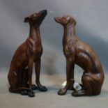 A pair of moulded figures of seated sighthounds, H.45cm (2)