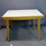 A retro beech wood kitchen table, raised on splayed tapered legs, H.73 W.90 D.61cm