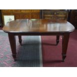 An Edwardian inlaid mahogany wind out dining table with 2 leaves, H.79 L.254 (fully extended) D.