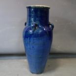 A large blue glazed floor standing wine vessel. H.74cm