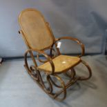 *WITHDRAWN* A bentwood and cane rocking chair. H.110 W.120 D.75cm