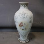A large baluster shaped glass vase, decorated with vignette of a lady and gentleman within scrolling