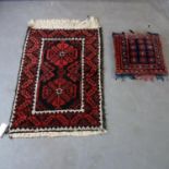 A small Eastern rug L.90 W.62cm and a kelim pillow.