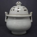 A Korean white glazed porcelain censer & cover, the cover pierced with trigrams, H.28, diam. 15 cm