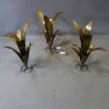 Three gilt metal candle holders of leaf design, H.59cm