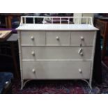 A cream lacquered chest of three short over two drawers, of bamboo design, H.96 W.102 D.44cm