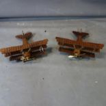 A pair of teak triplanes, H.20 W.51 D.51cm