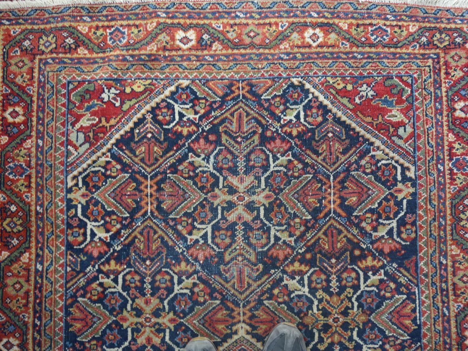 A Persian Qashqai rug, central diamond medallion and floral motifs on a dark blue ground, within - Image 3 of 5