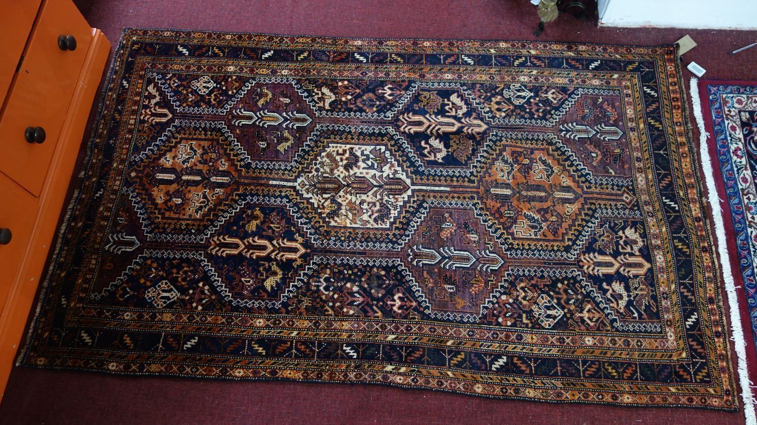 A Southwest Persian Lori rug, repeating stylised geometric and petal motifs within stylised multi