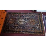 A Southwest Persian Lori rug, repeating stylised geometric and petal motifs within stylised multi