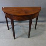 A mahogany demi-lune console table, raised on tapering legs, H.73 W.91 D43cm