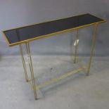 A contemporary gilt rectangular console table, with smoked glass top, H.79 W.107 D.33cm