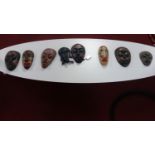 A collection of eight carved African tribal masks (8)