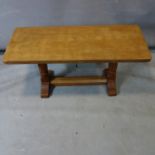 Robert 'Mouseman' Thompson, an adzed oak coffee table raised on trestle supports, with mouse