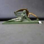 An Art Deco figure of a reclining lady and a dove, signed 'Picchioli' and with impressed mark '
