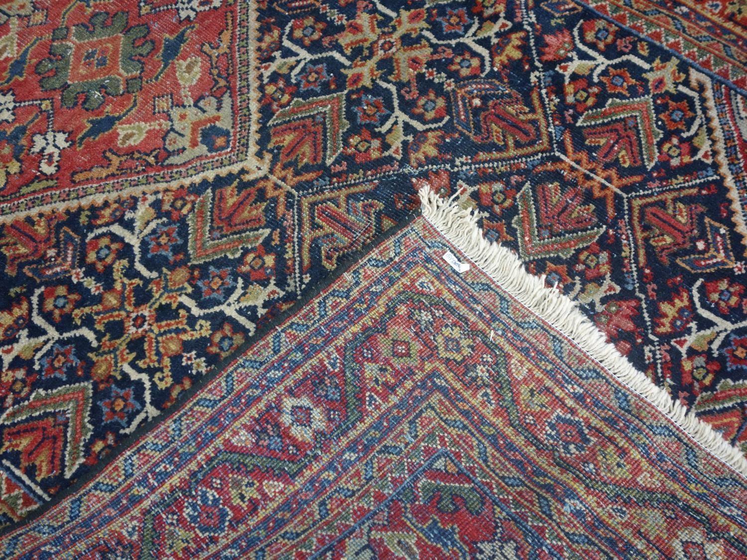 A Persian Qashqai rug, central diamond medallion and floral motifs on a dark blue ground, within - Image 5 of 5