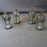 A set of four gilt storm lanterns, H.45cm
