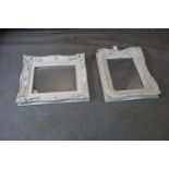 A wall mirror with white painted floral frame, having rectangular glass plate, 59 x 48cm