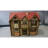 A 1940's Tudor style vintage dolls house, together with furniture, H.65 W.78 W.31cm